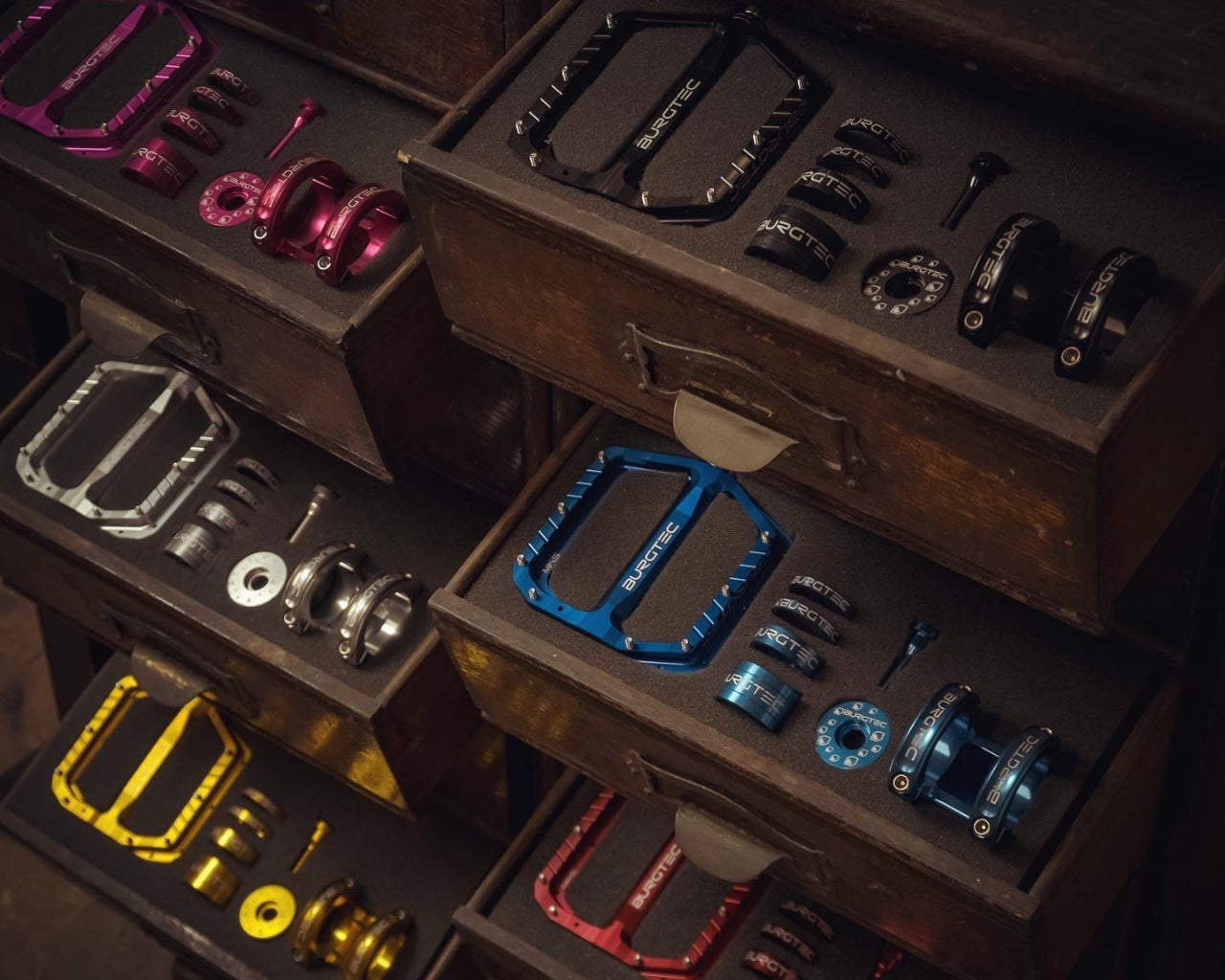 Burgtec components laid out in a draw