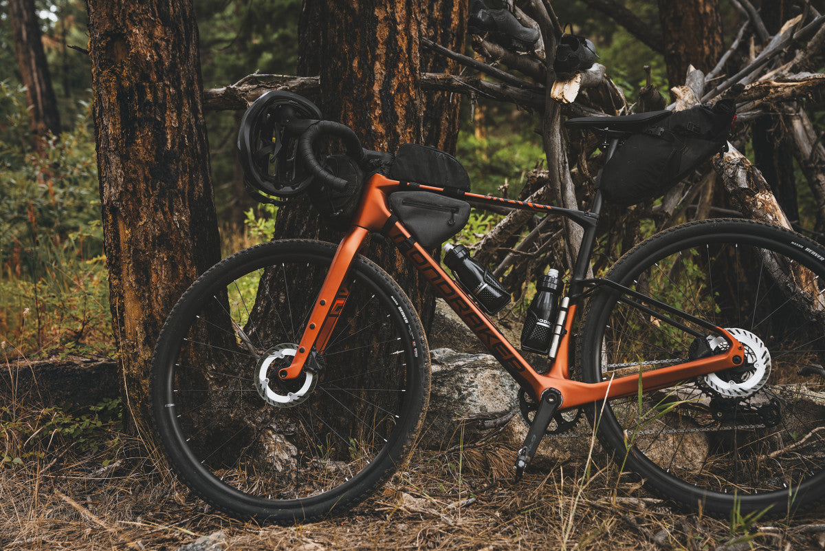 mondraker arid gravel bike loaded up with bags and bottles