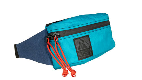 High above Rad Pack in teal with orange string