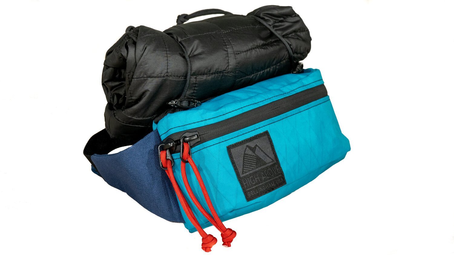 High above radpack in teal with coat attached to it